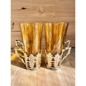 Set of 4 vintage colored (Amber) tea glasses in silver tone plastic holders.